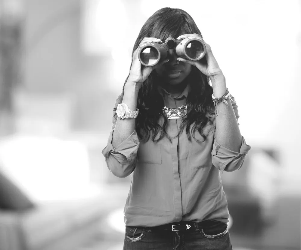 Woman looking through binoculars