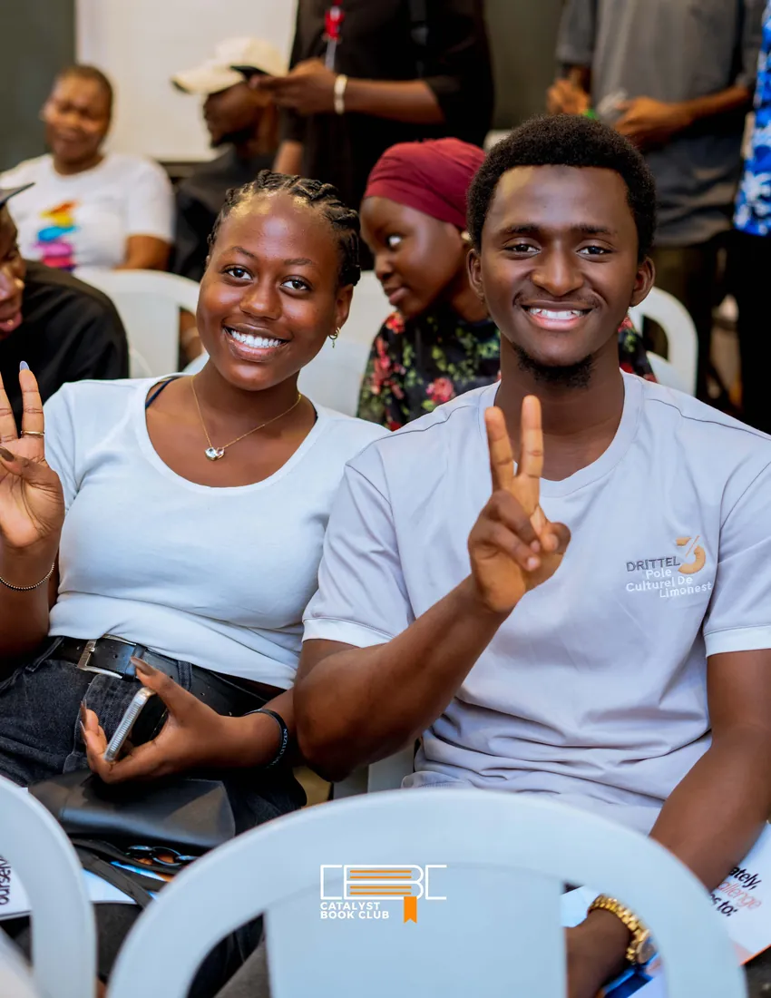 Two Catalyst Book Club members making peace signs
